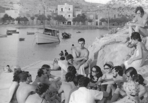 Social gathering by Xlendi bay
