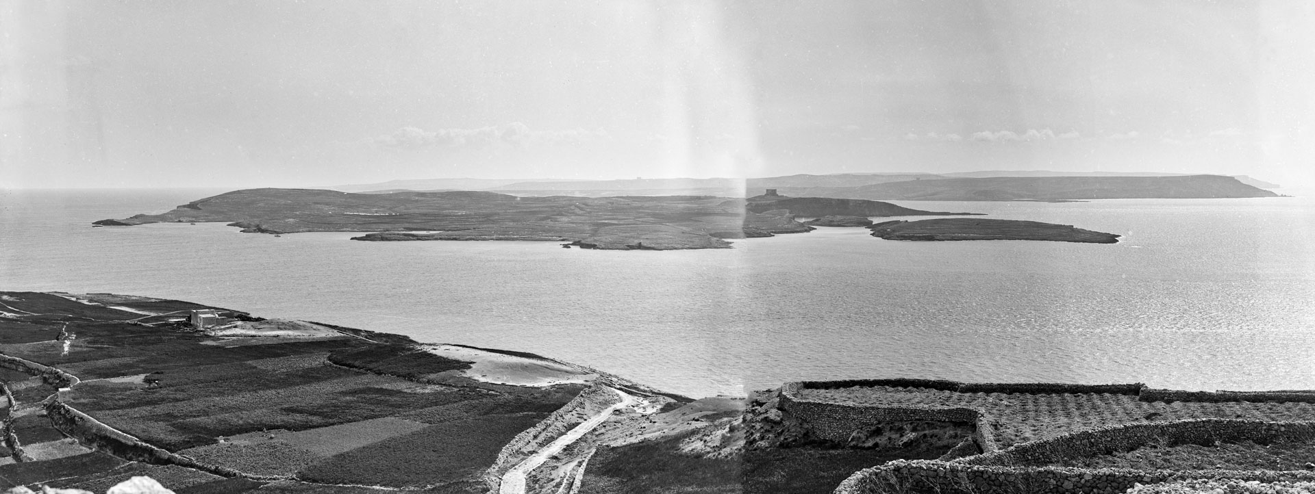 A two negative panorama of the island of Comino captured by Richard Ellis in 1890.