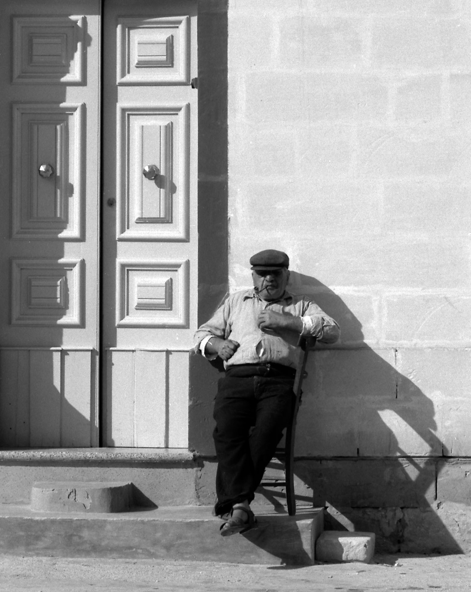 A Gozitan enjoying the sunshine in Gharb, as captured by David Wrightson in October 1964.