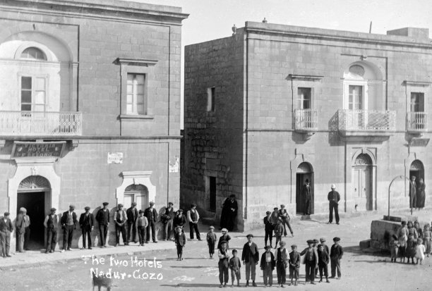 The two squares in Nadur, one in front and one behind the main parish church, the latter housing two hotels, 1920s; photographer unknown. Courtesy of Nadur parish archive.