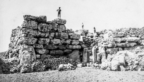 A man perched atop the megaliths in Xaghra.