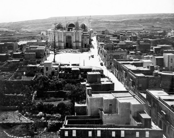 The demolition and building of the new Xewkija parish church in the 1970s, captured in aerial view by Gino Theuma.