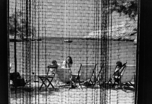 A view of Xlendi Bay through the texture of an abode's door curtain, as captured by Guido Stilon in 1958. Courtesy of Grace Cilia Vincenti & National Archives of Malta.