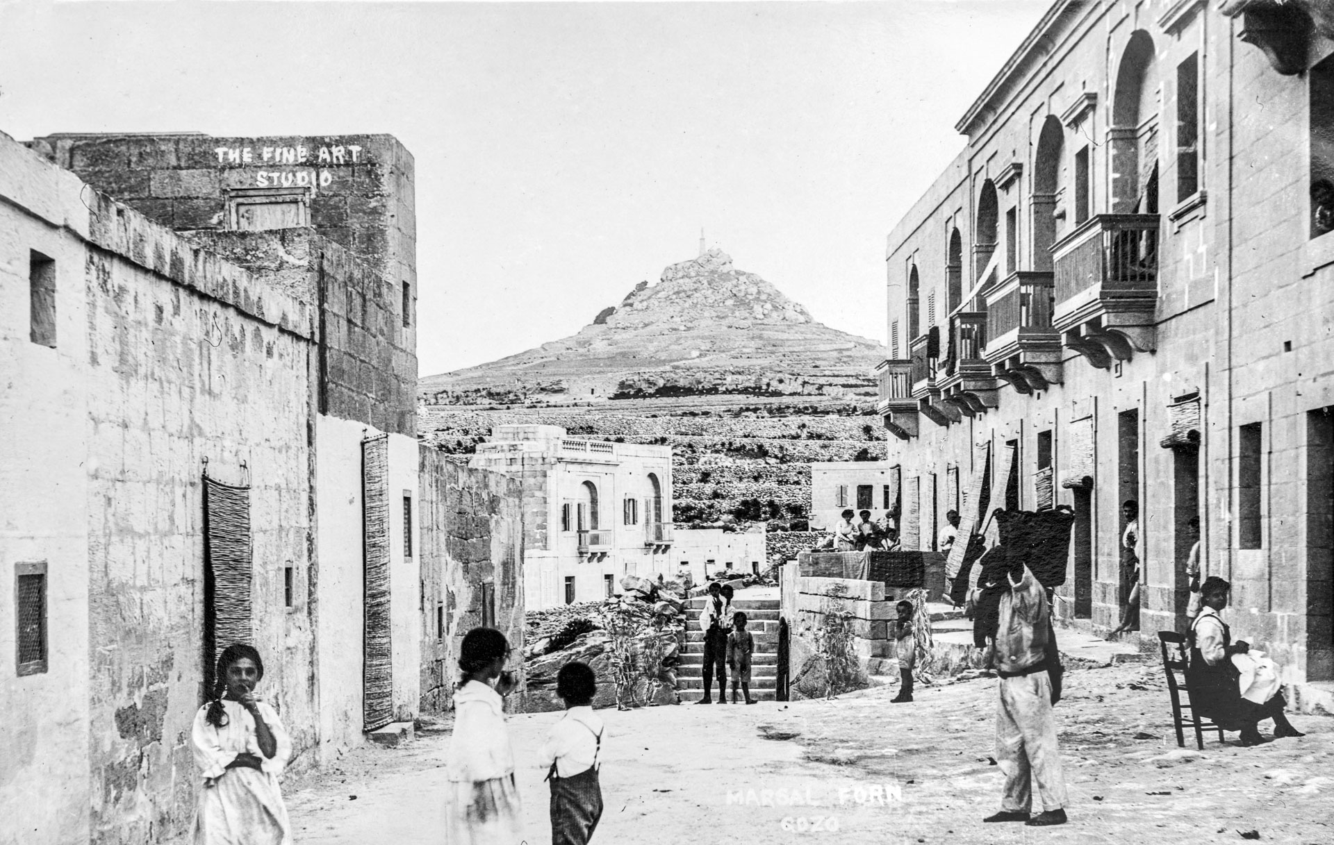 A streetscape of Marsalforn on the road leading to Qbajjar, now completely obliterated, as captured by Antonio Serracino.