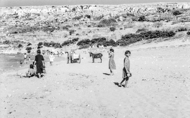 Ramla Bay, idyllic and barely touched, as captured by Guido Stilon in the 1960s.