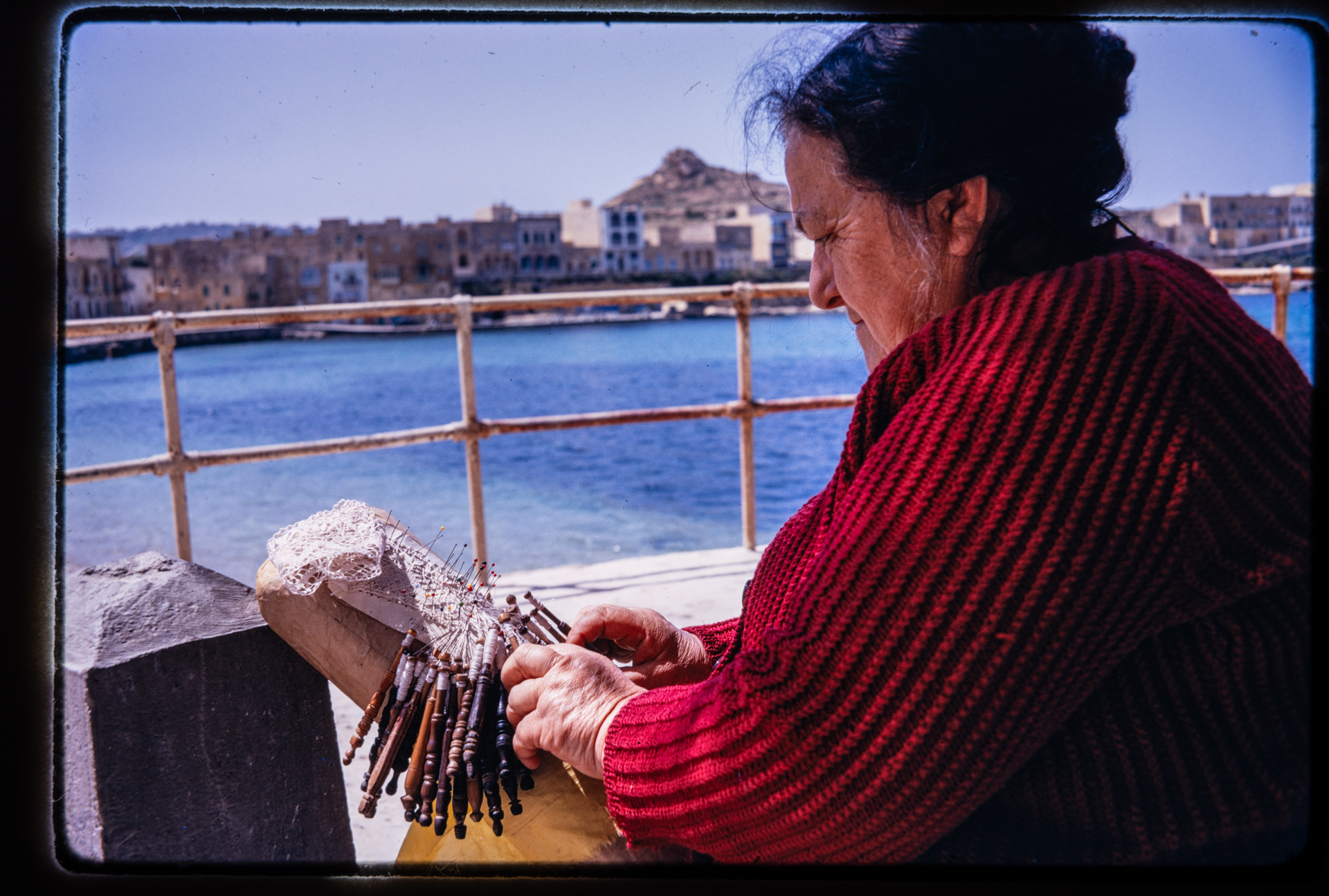 A lace worker showcasing her skill in Marsalforn in 1971.