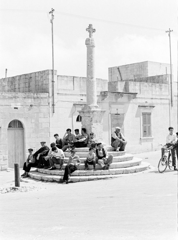 A congregation at the cross in the Xewkija main square, as captured by Guido Stilon in the 1970s. Courtesy of Grace Cilia Vincenti & National Archives of Malta.