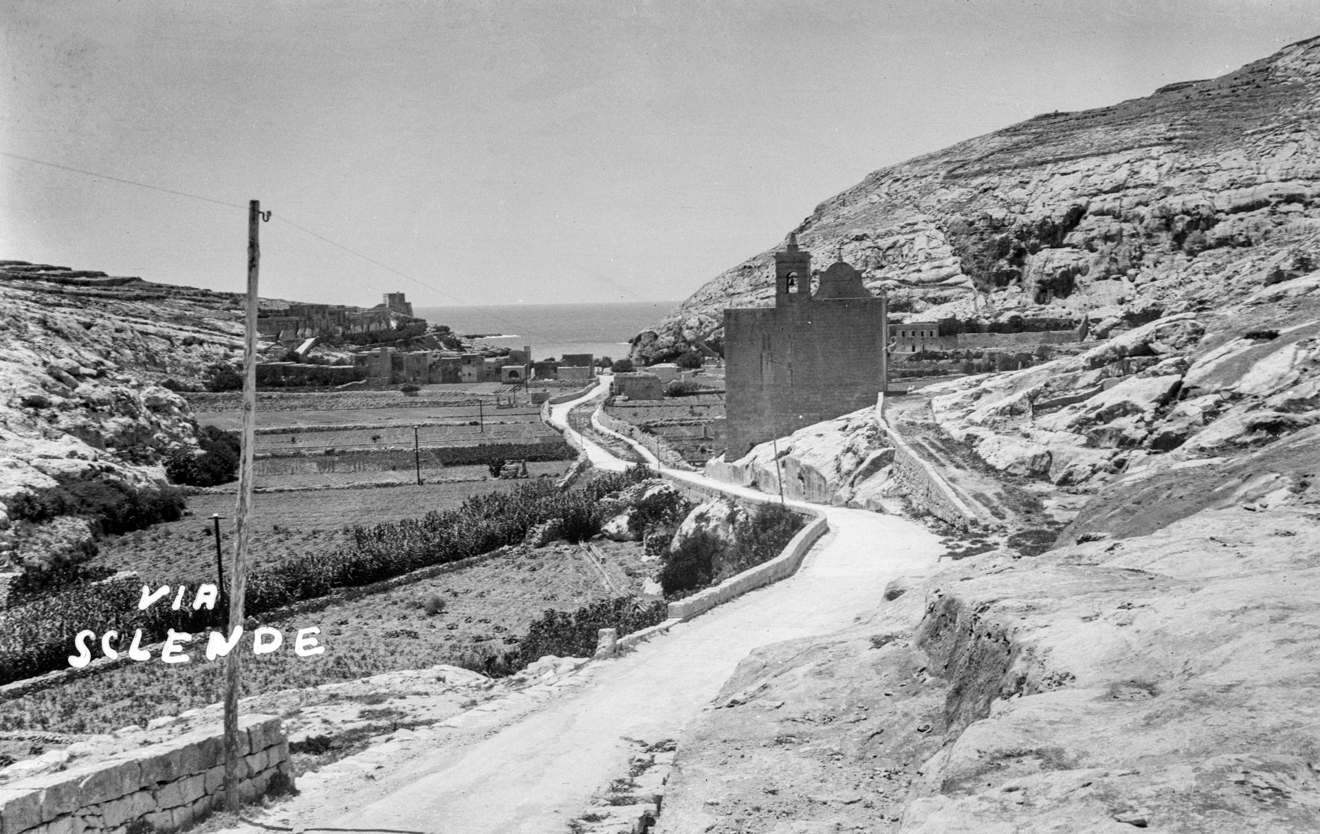 A view of the road leading down to Xlendi Bay from Fontana, circa 1930; photographer unknown.