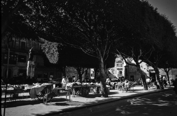Sellers exhibit their wares at Tokk Square in Victoria, as captured by Guido Stilon in the 1960s.