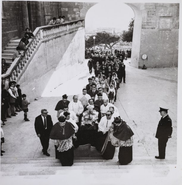 A funeral approaching the Cathedral within the Citadel.