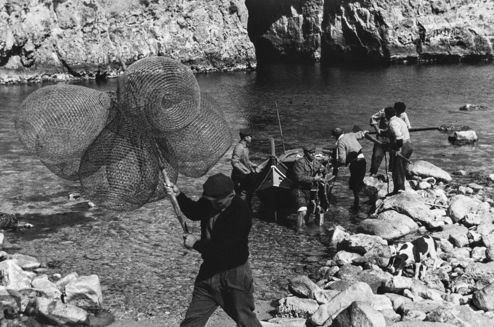 Fisherman land at the Inland Sea in Dwejra, circa 1940; photographer unknown.