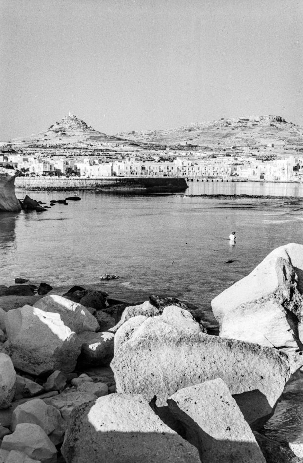 An early morning bather in Marsalforn, as captured by Guido Stilon in 1958. Courtesy of Grace Cilia Vincenti & National Archives of Malta.