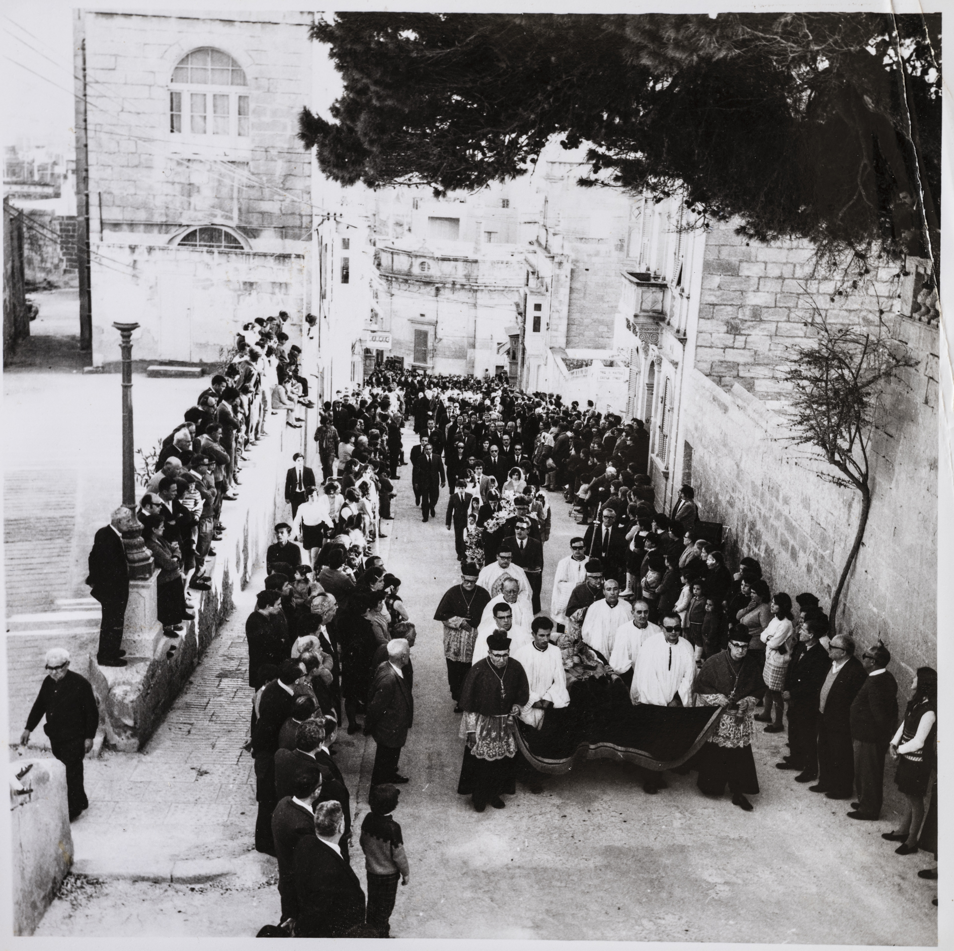 A funeral approaching the Cathedral within the Citadel.