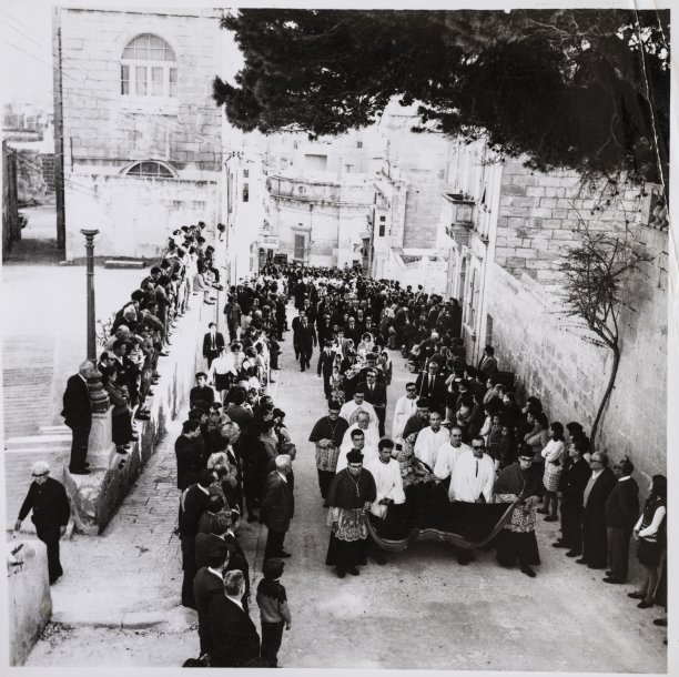A funeral approaching the Cathedral within the Citadel.