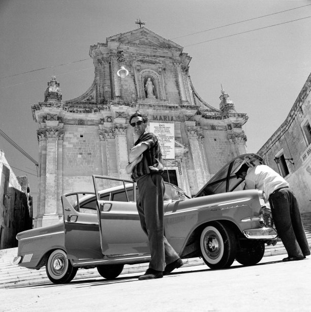 The late Professor Quentin Hughes posed in front of the Cathedral within the Citadel in Victoria, captured by the late David Wrightson in October 1964.