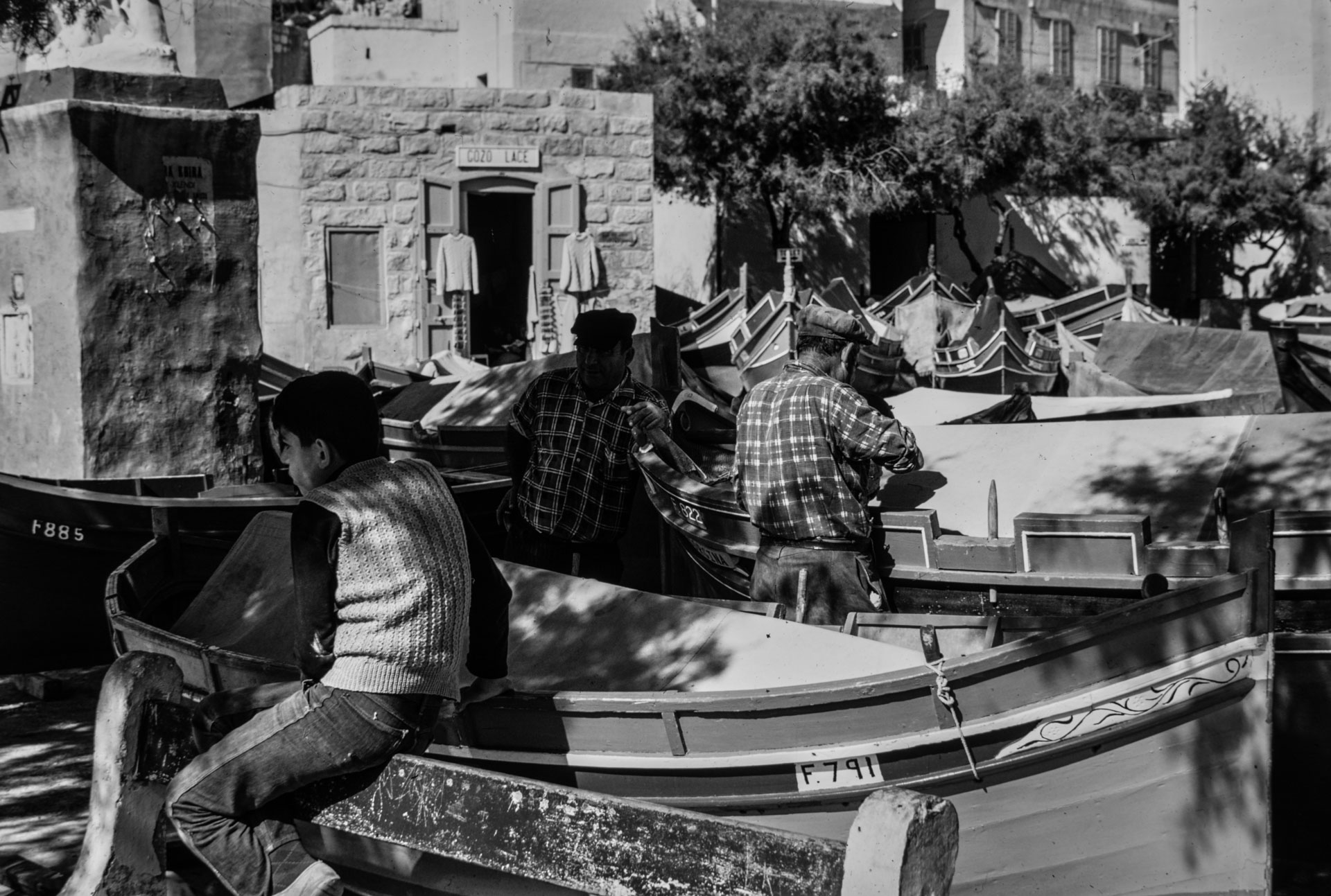 A group of fishermen in Xlendi Bay, as captured by Guido Stilon in the 1960s.