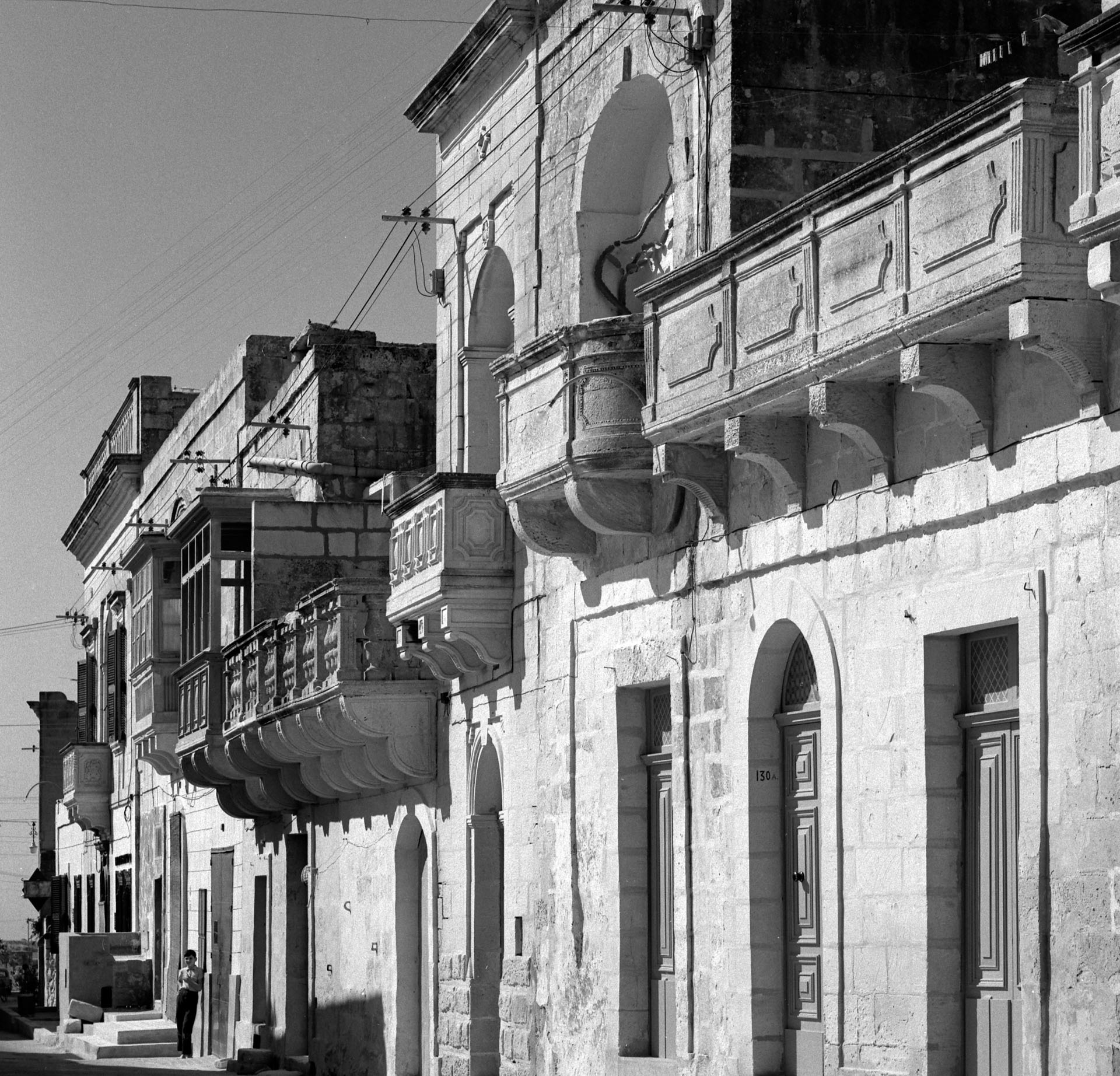 An image from Gharb showcasing the typical vernacular architecture of this village, namely the stone balconies, as captured by David Wrightson in October 1964.