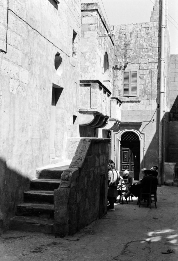 A beautiful scene in the streets behind St George Basilica in Victoria, as captured by Guido Stilon in the 1960s.