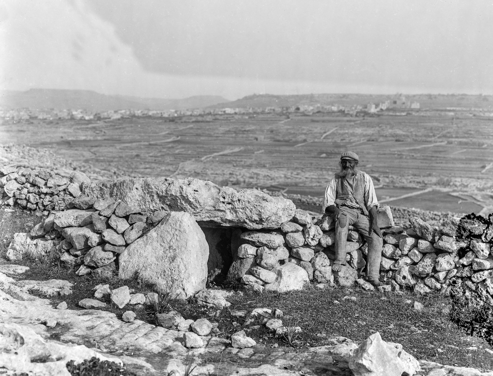 Two dolmens documented by Richard Ellis in the 1890s, with a Gozitan fellow seated nearby for scale.