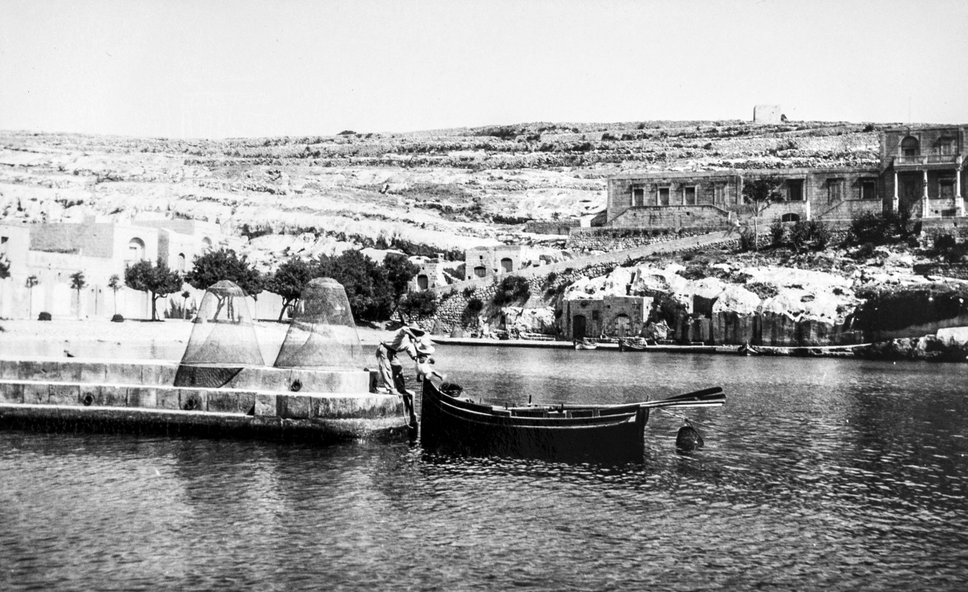 An image of the boat landing area at Xlendi, captured by Geo Furst in 1930.
